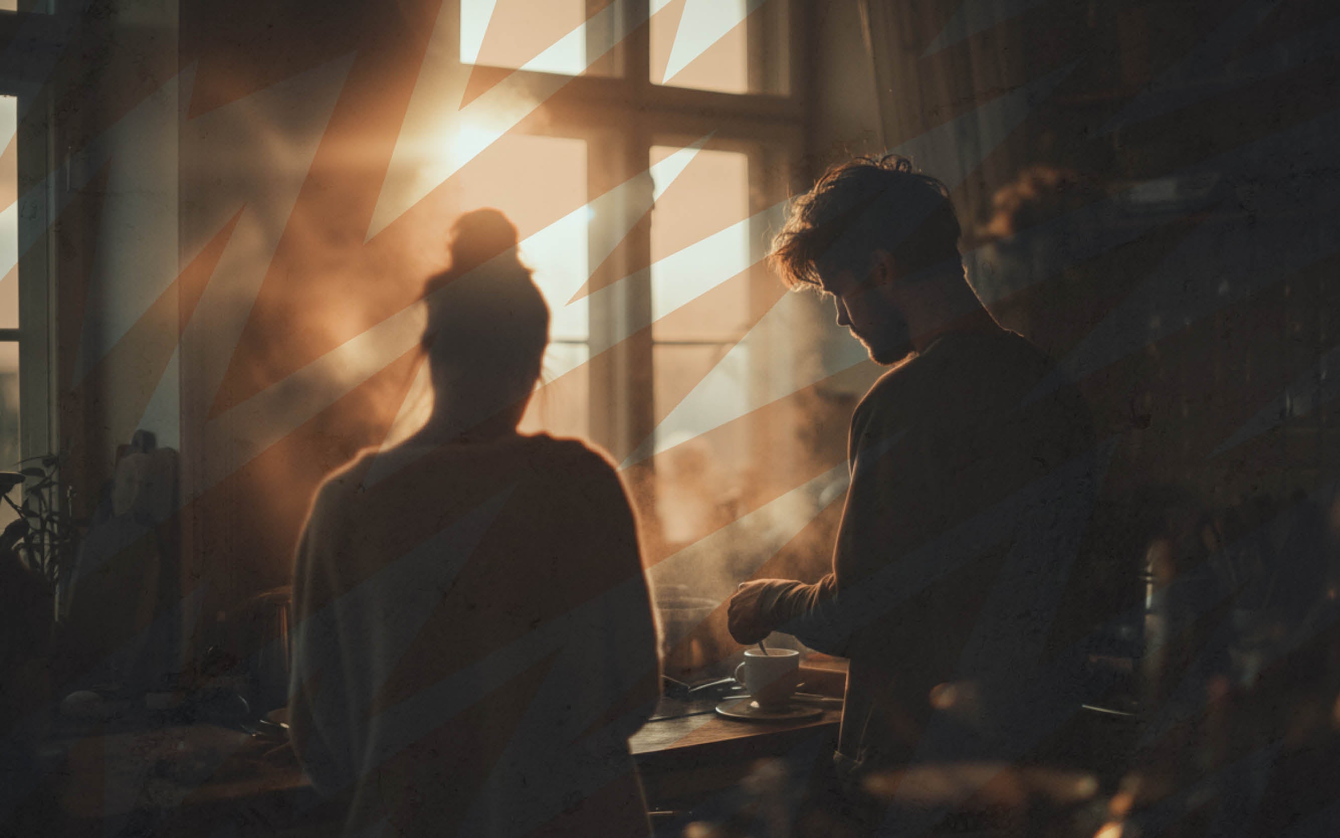 Ein Mann und eine Frau in der Küche am Morgen.